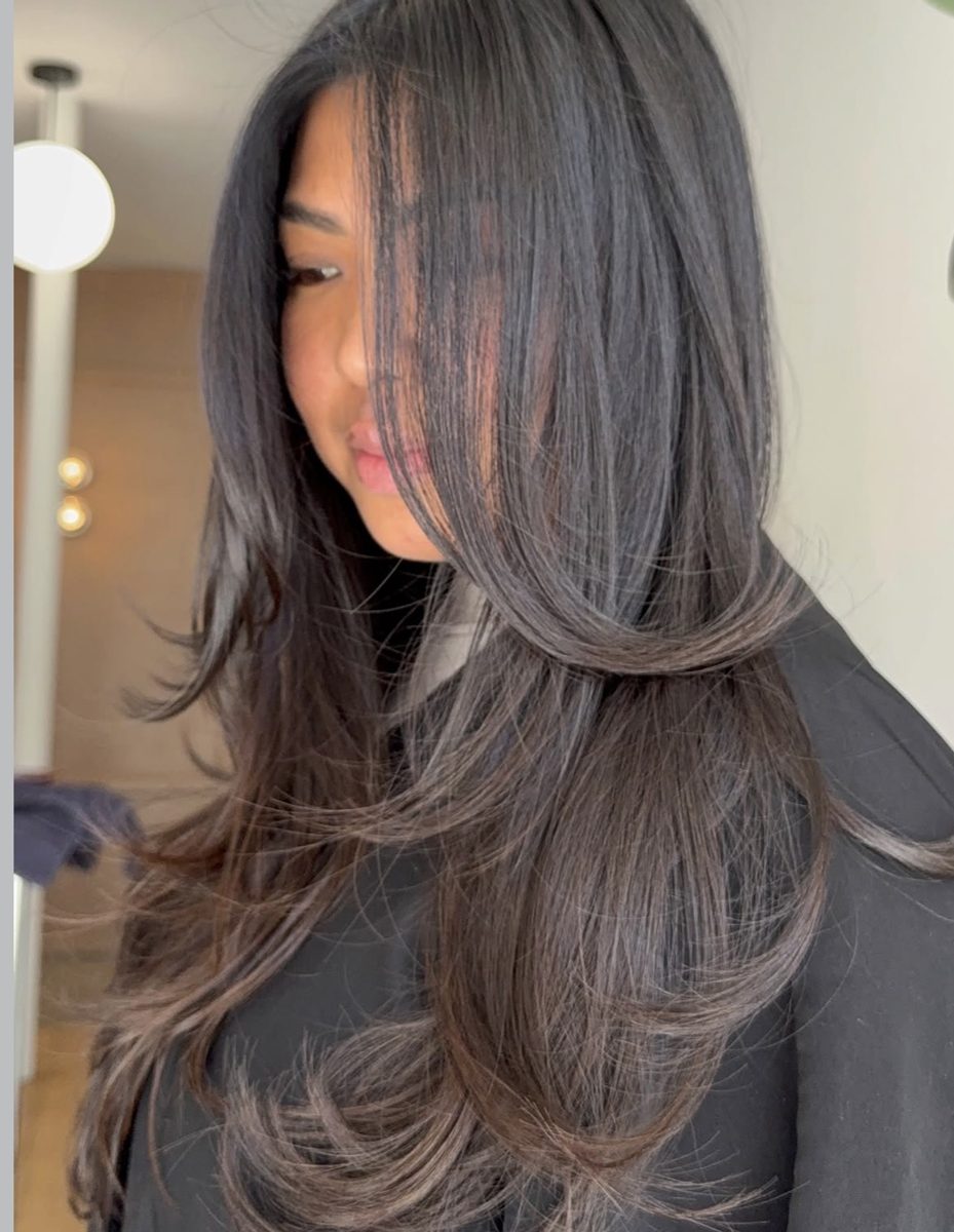 Long face framing layers at Ra'pôr Salon in Costa Mesa