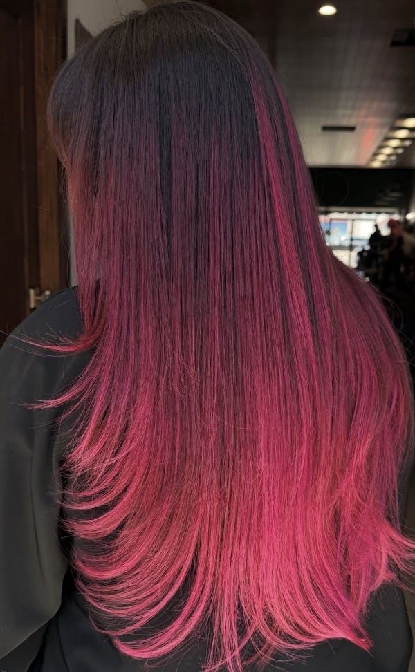 Dark to pink ombré on long straight hair at Ra'pôr Salon in Costa Mesa